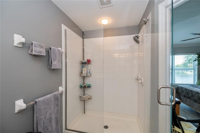 bathroom featuring visible vents and a stall shower