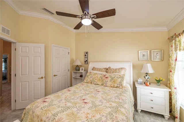 bedroom with light colored carpet, ornamental molding, and ceiling fan