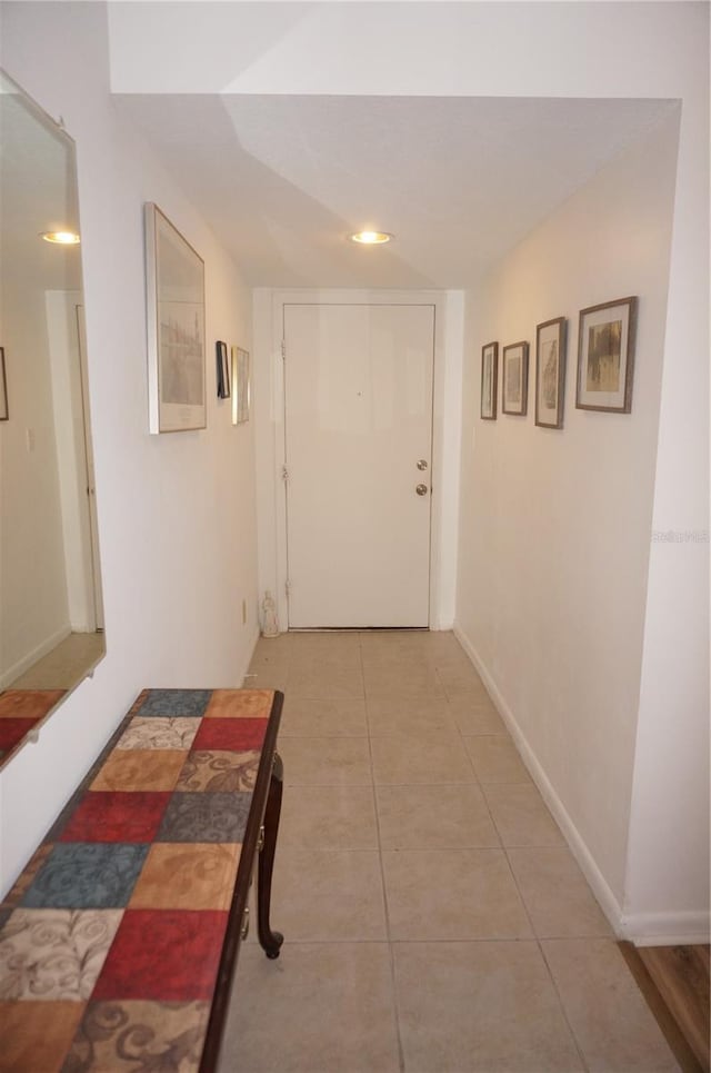 corridor with light tile patterned flooring