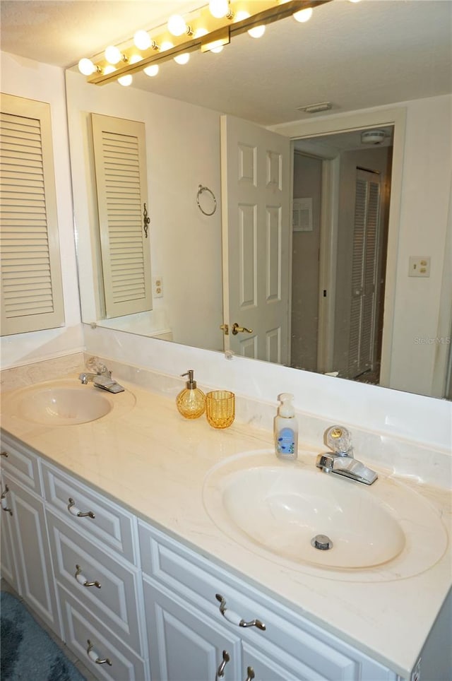 bathroom featuring double vanity