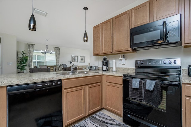 kitchen with sink, kitchen peninsula, decorative light fixtures, and black appliances