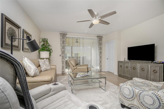 tiled living room with ceiling fan