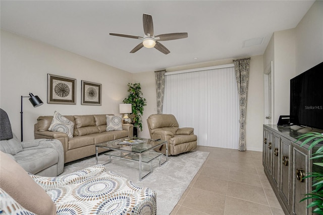 living room with ceiling fan and light tile patterned flooring