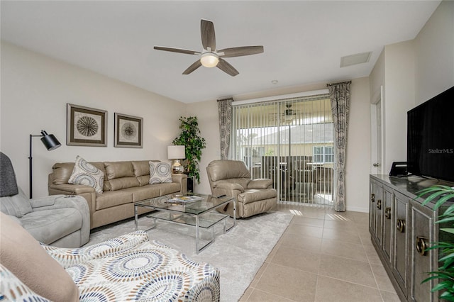 living room with ceiling fan and light tile patterned floors