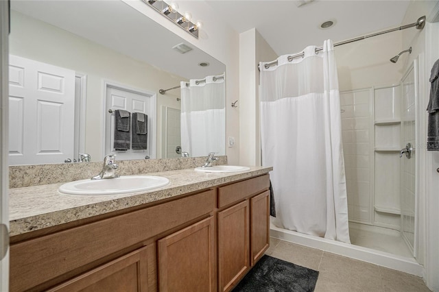 bathroom with tile patterned flooring, dual vanity, and curtained shower