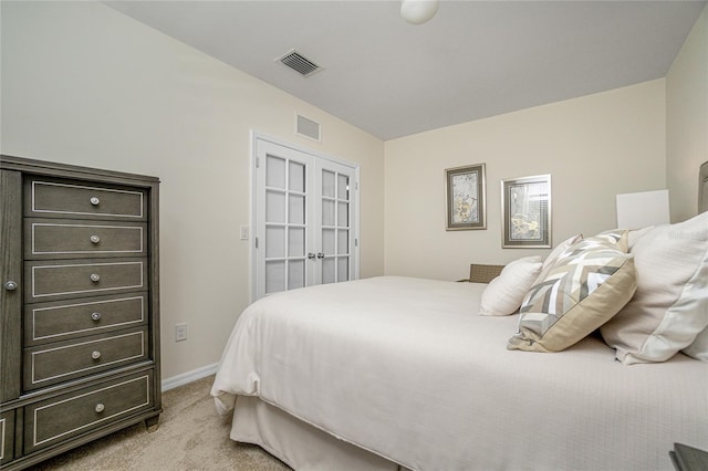 bedroom featuring light colored carpet