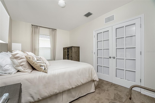 bedroom with light colored carpet