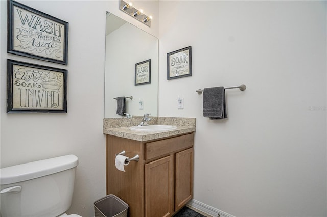 bathroom with toilet and vanity