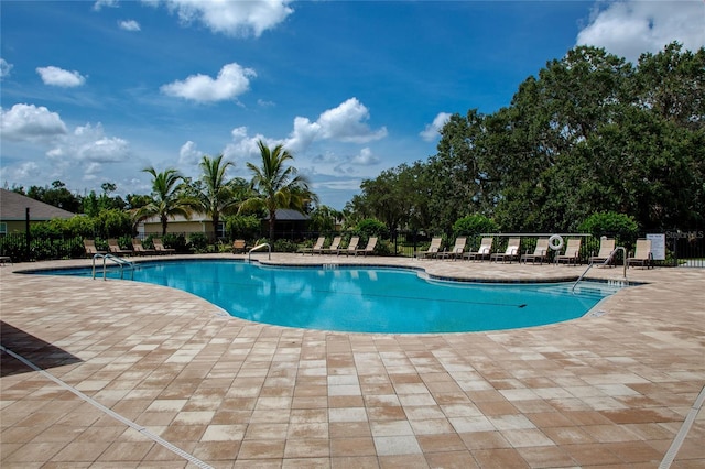 view of pool featuring a patio area