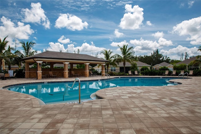 view of swimming pool with a gazebo and a patio