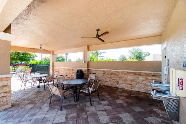 view of patio featuring ceiling fan