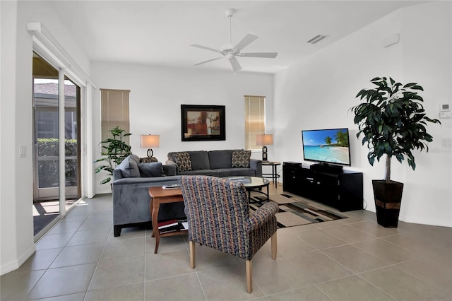 living room featuring ceiling fan and light tile patterned flooring