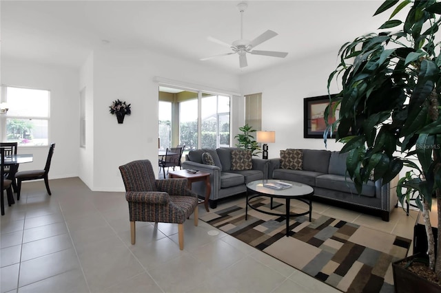 living room featuring ceiling fan, a wealth of natural light, and tile patterned floors