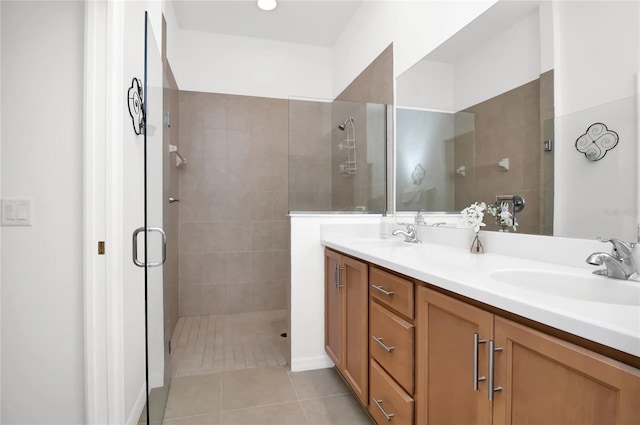 bathroom featuring tile patterned floors, double sink vanity, and an enclosed shower