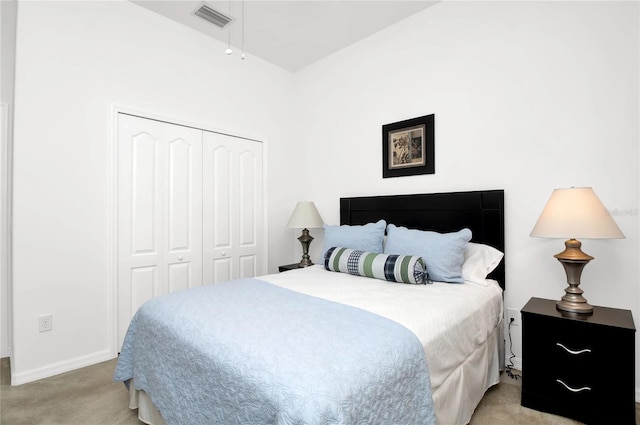 carpeted bedroom with a closet