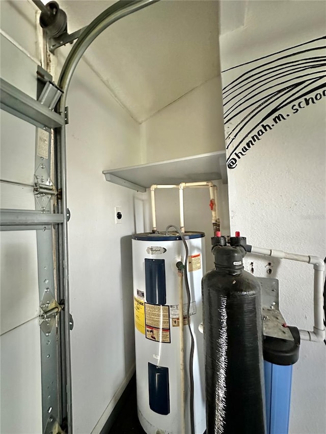 utility room featuring water heater