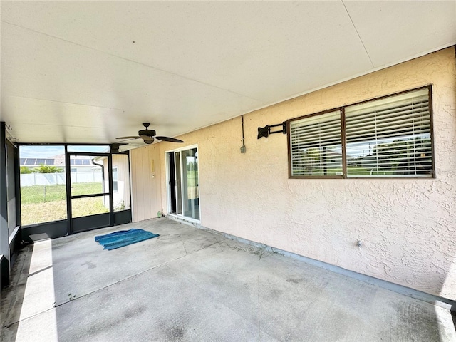 exterior space featuring ceiling fan