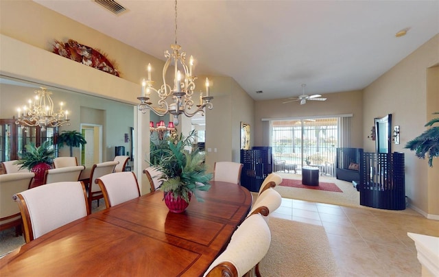 dining space featuring light tile patterned flooring and ceiling fan with notable chandelier