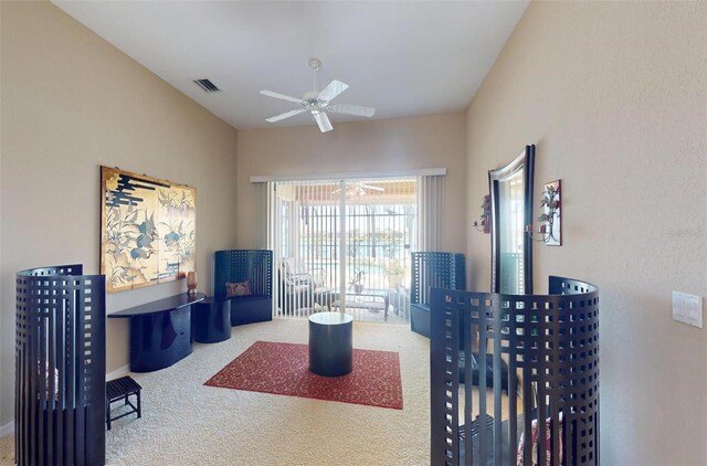 office with carpet floors and ceiling fan