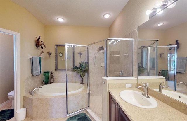 full bathroom featuring plus walk in shower, vanity, and toilet