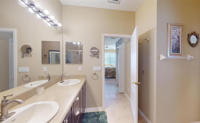 bathroom with tile patterned floors and vanity