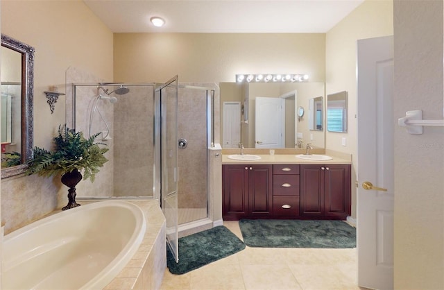 bathroom with separate shower and tub, vanity, and tile patterned floors