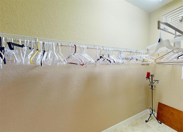 spacious closet featuring tile patterned floors