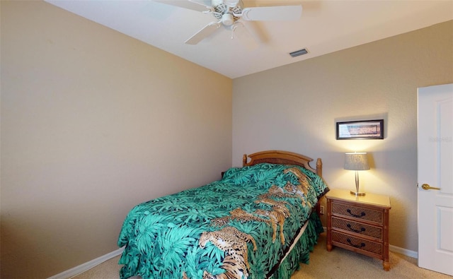 bedroom with light colored carpet and ceiling fan