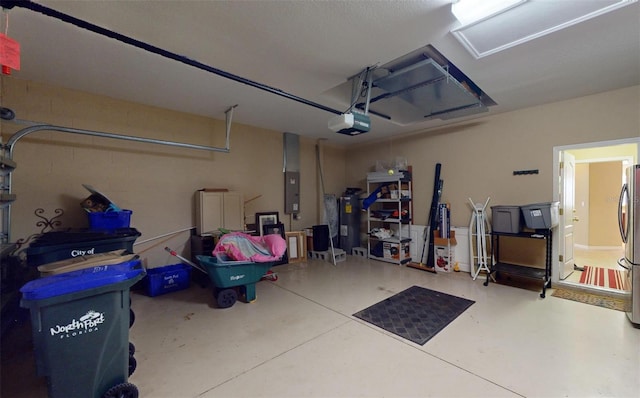 garage with a garage door opener, electric panel, and stainless steel refrigerator