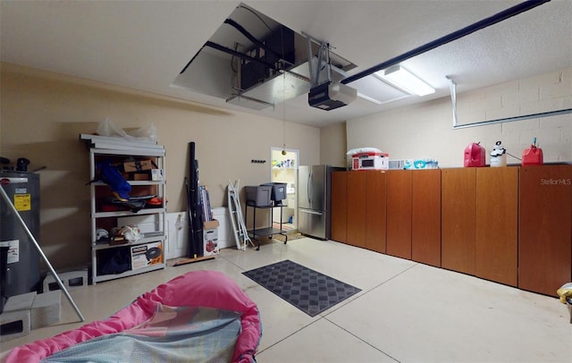 garage featuring stainless steel refrigerator and a garage door opener