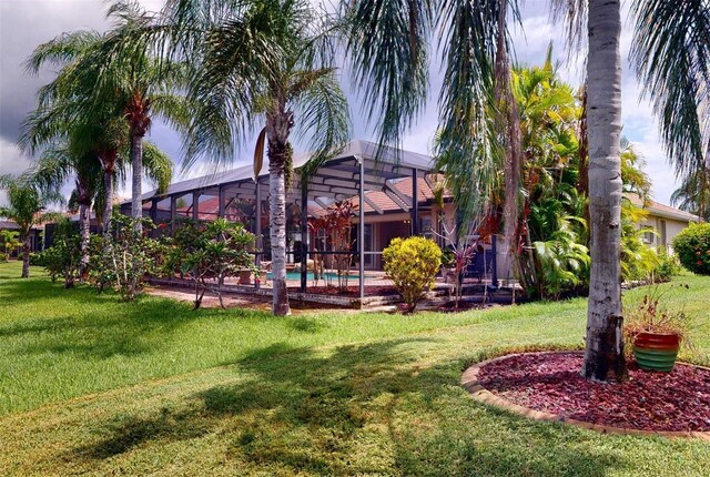 view of yard featuring a lanai