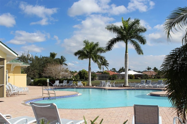 view of swimming pool with a patio