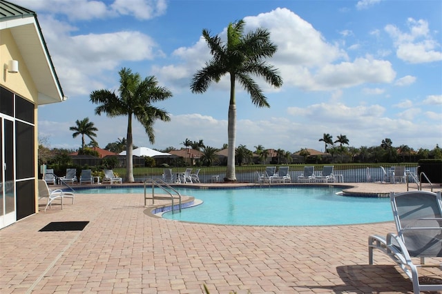 view of swimming pool with a patio