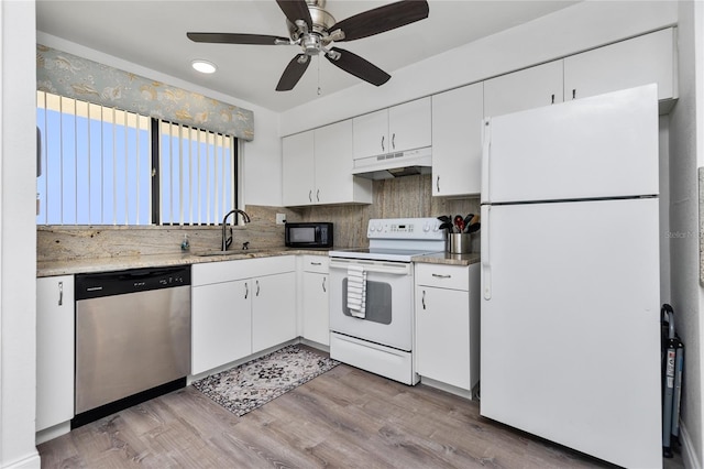 kitchen featuring white cabinets, white appliances, sink, and light hardwood / wood-style flooring