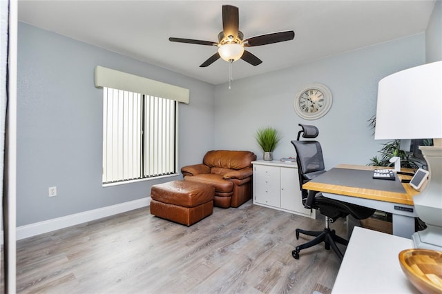 home office with ceiling fan and light wood-type flooring