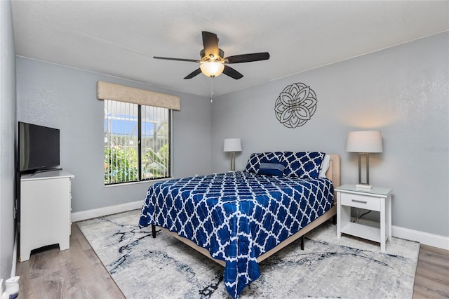 bedroom featuring ceiling fan and wood-type flooring