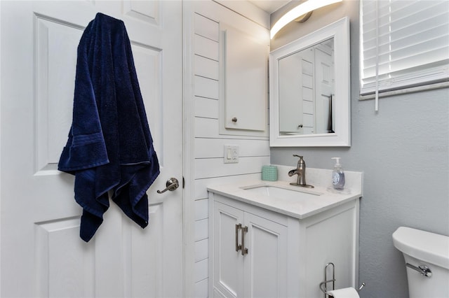 bathroom featuring vanity and toilet