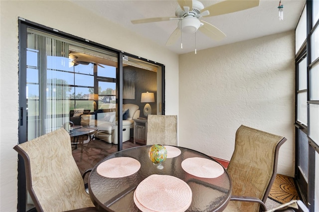 dining area with plenty of natural light and ceiling fan