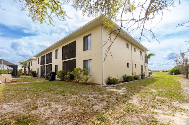 view of property exterior with a yard