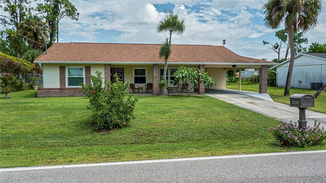 ranch-style house with central AC, a front lawn, and concrete driveway