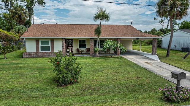 ranch-style house featuring concrete driveway, central air condition unit, a front lawn, a porch, and brick siding