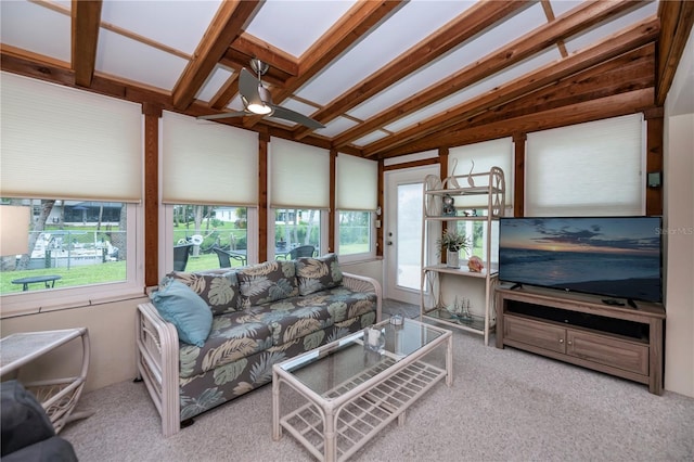 living area with a ceiling fan, lofted ceiling, and light carpet