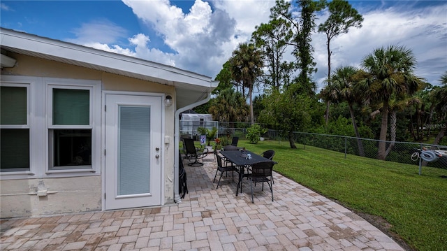 view of patio with fence private yard and outdoor dining space