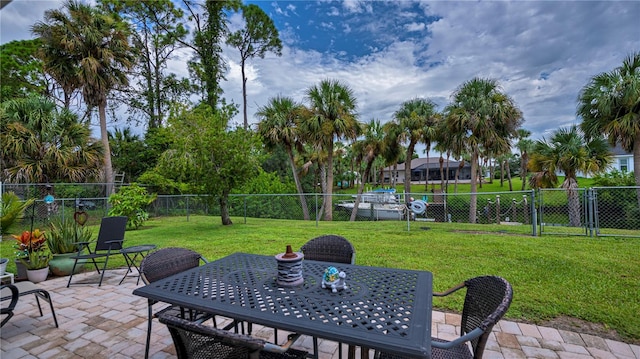 view of patio with outdoor dining space and fence