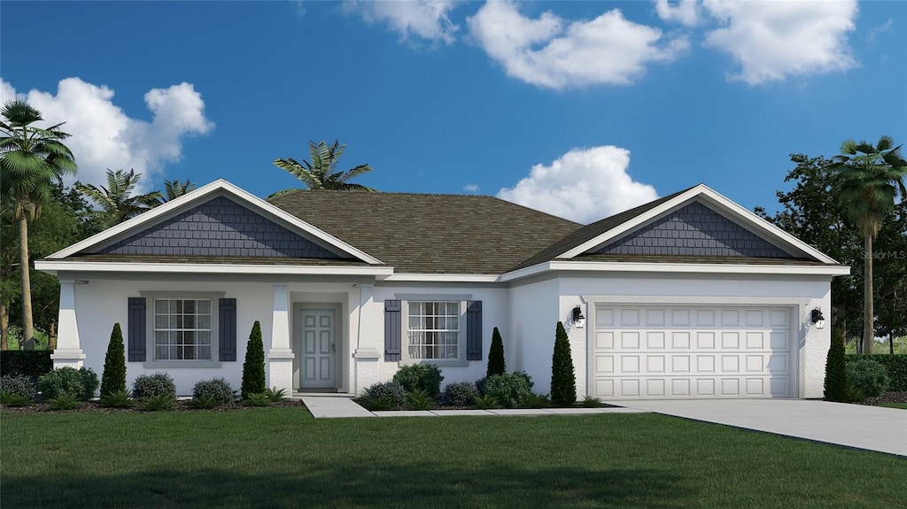 view of front of property featuring a garage and a front yard