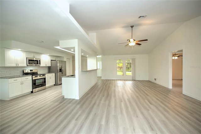 interior space featuring ceiling fan, high vaulted ceiling, and light hardwood / wood-style flooring