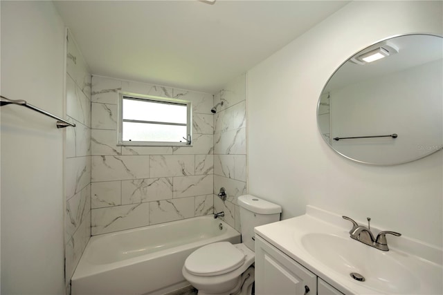 full bathroom featuring tiled shower / bath, toilet, and vanity