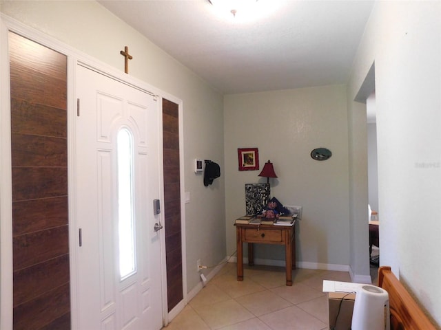 foyer featuring light tile patterned floors