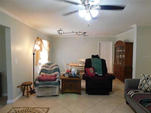 tiled living room featuring ceiling fan, track lighting, and crown molding