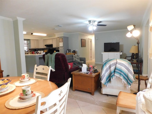 living room with ceiling fan, light tile patterned floors, and ornamental molding